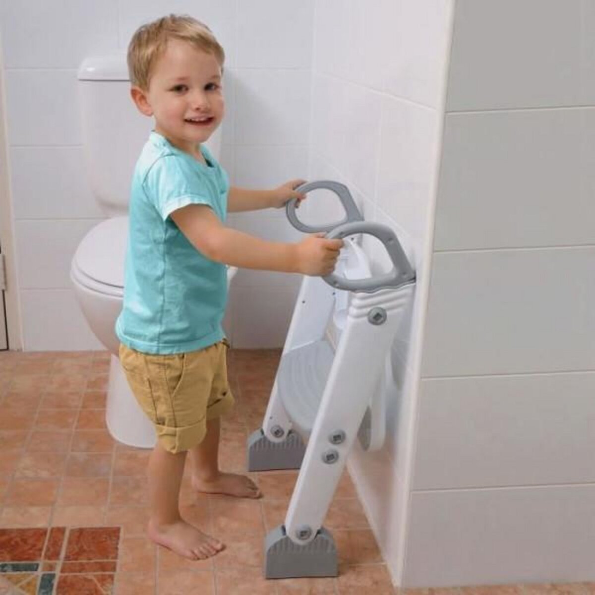 MARKET24 Réducteur de WC - DREAMBABY - STEP-UP - Siege d'apprentissage de la propreté - 2 étages réglables - Gris