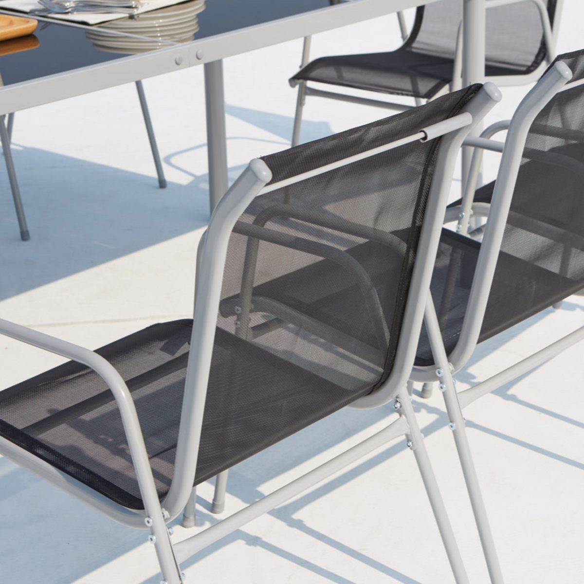 CONCEPT USINE Table de jardin et 8 chaises en acier et toile PVC gris LUSIANA