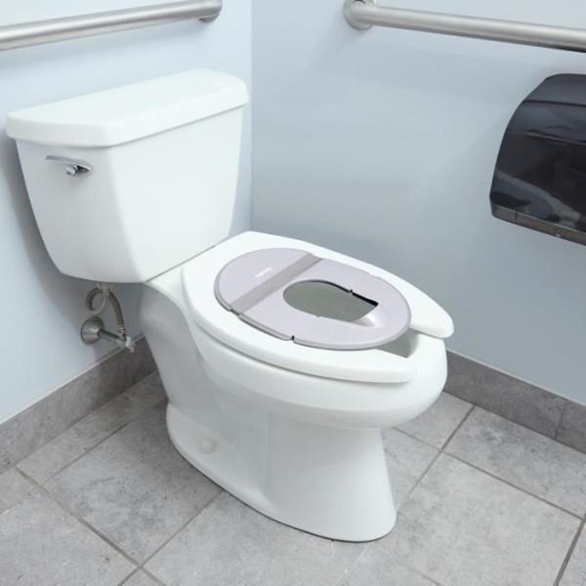 Voir la diapositive 5 : MARKET24 INGENUITY Réducteur de toilette universel nomade enfant, bébé, en voyage ou déplacement. Sac de rangement inclus, pliable