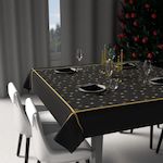 SOLEIL D'OCRE Nappe festive imprimée anti-tâches FLOCONS, par Soleil d'Ocre. Coloris disponibles : Noir