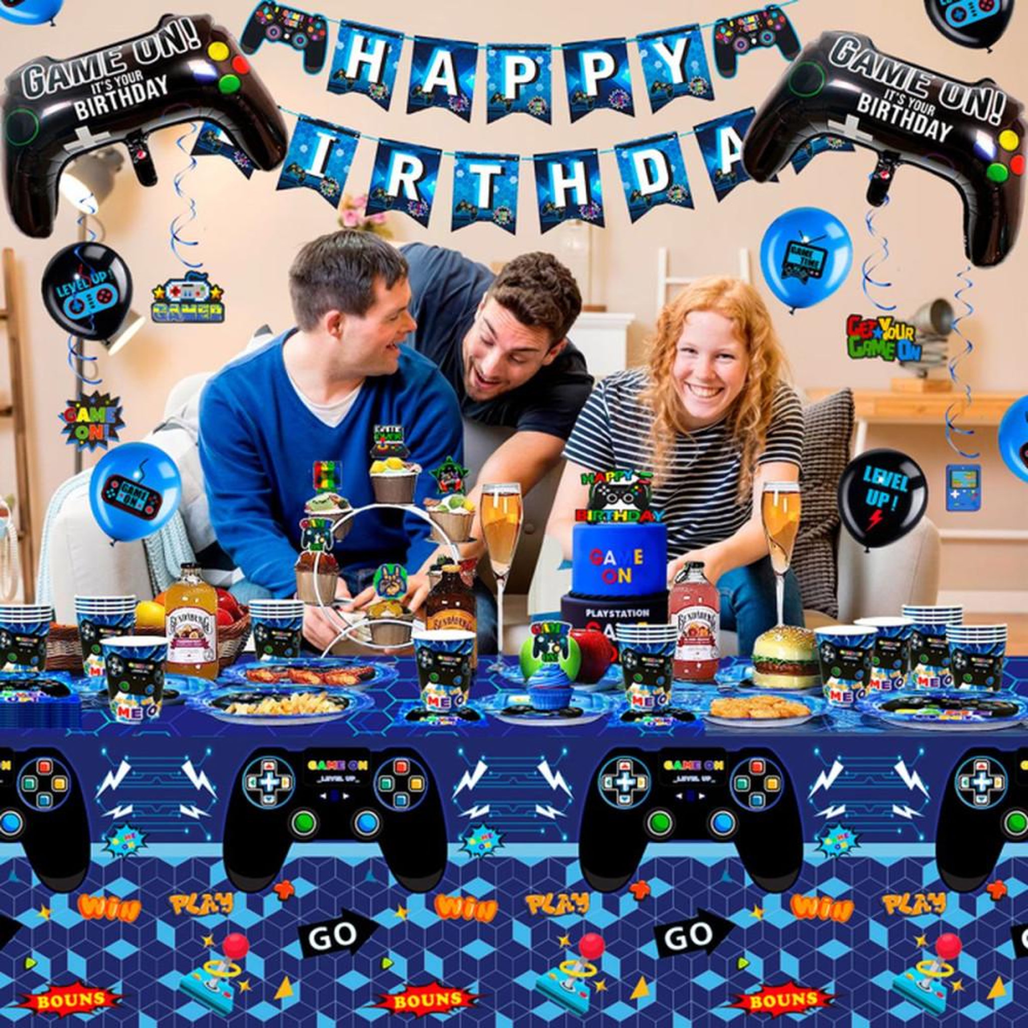 Voir la diapositive 6 : Kit déco anniversaire jeux vidéo : bannière tissu, nappe, assiettes et gobelets, ballons aluminium, stickers et décorations gâteau