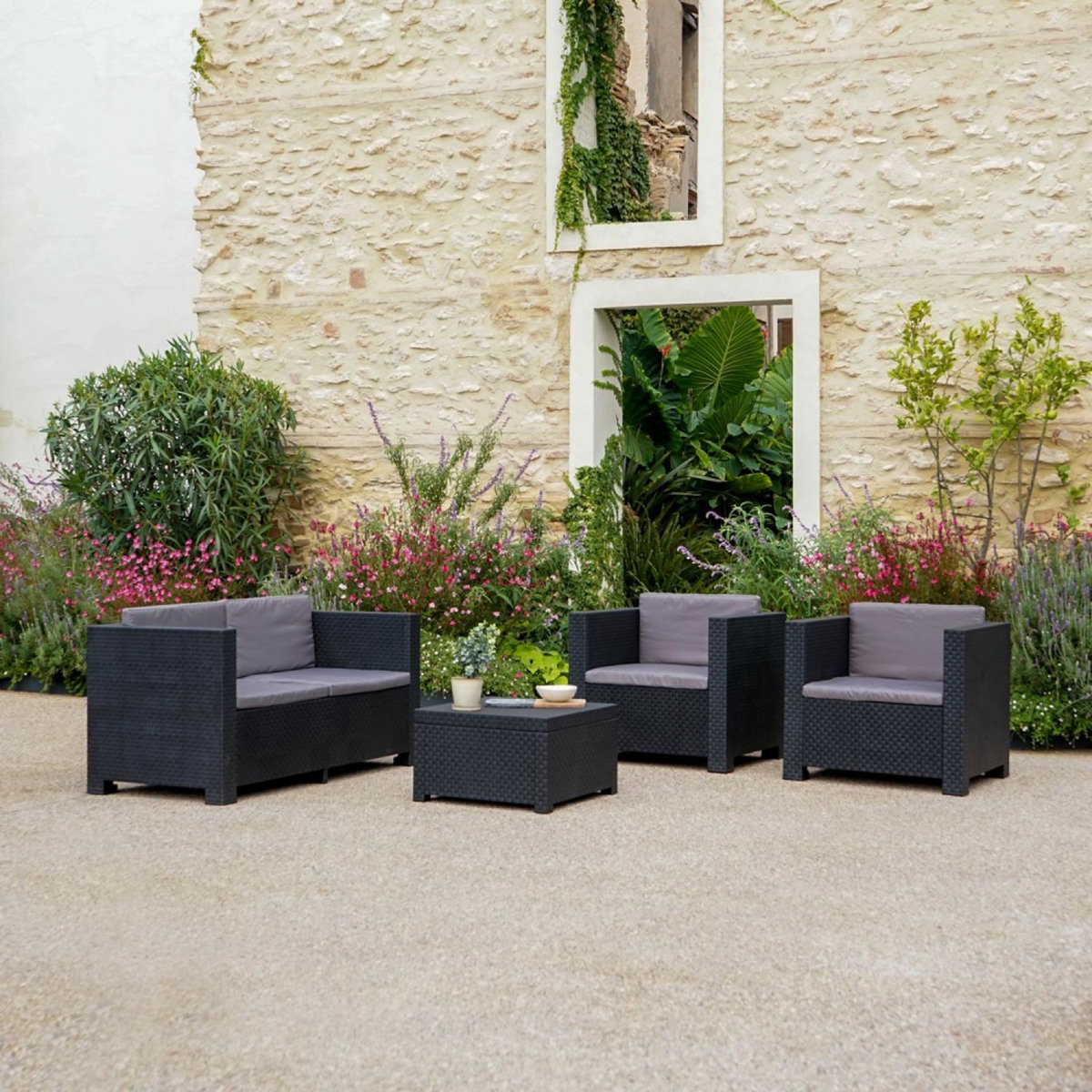 CONCEPT USINE Salon de jardin 4 places en résine tressée avec table et coffre de rangement gris SOLIS