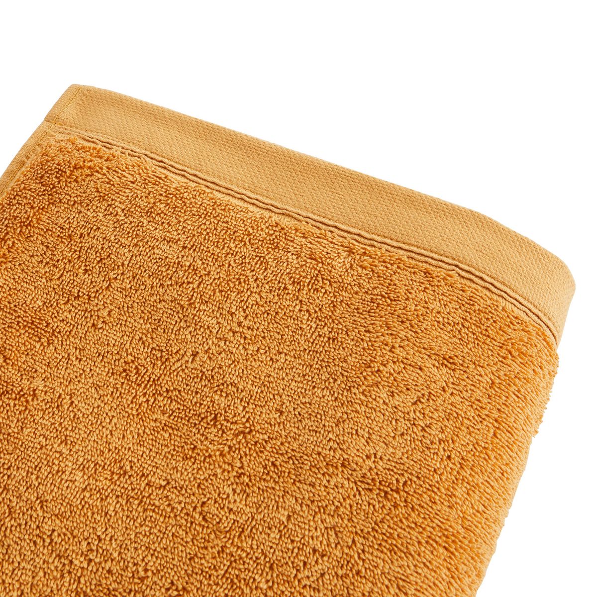 Serviette de toilette unie en coton 600 g/m²