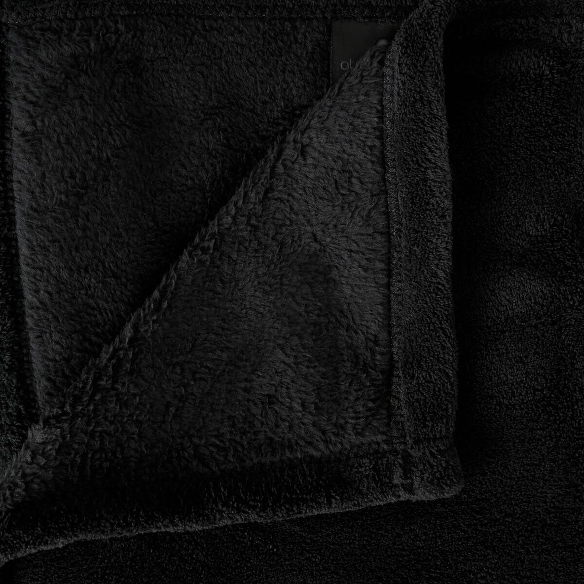 Voir la diapositive 2 : ATMOSPHERA Plaid polaire microfibre 125x150cm noir