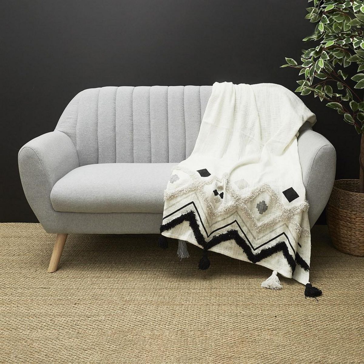 The Home Deco Factory Jeté de canapé ethnique tufté noir 130x150 cm