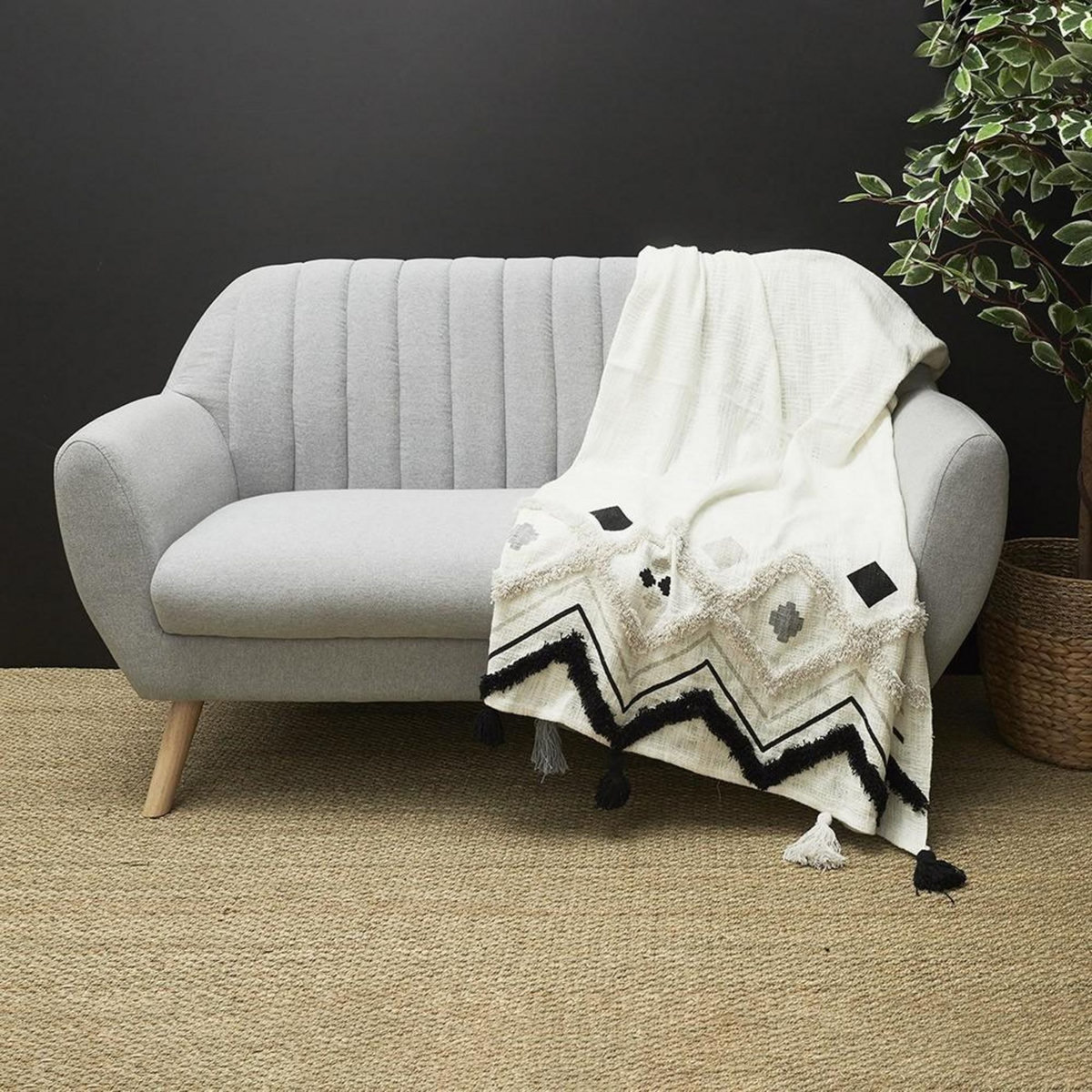 The Home Deco Factory Jeté de canapé ethnique tufté noir 130x150 cm