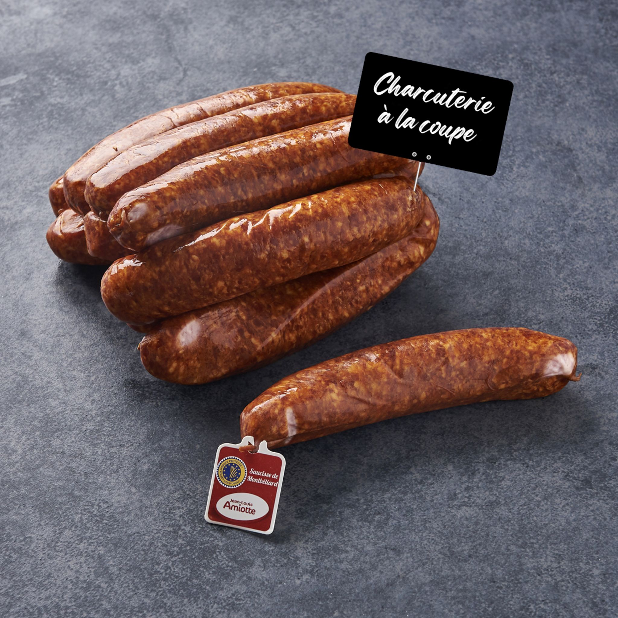 Voir la diapositive 2 : MON CHARCUTIER Saucisse de Montbéliard IGP 1 pièce 175g