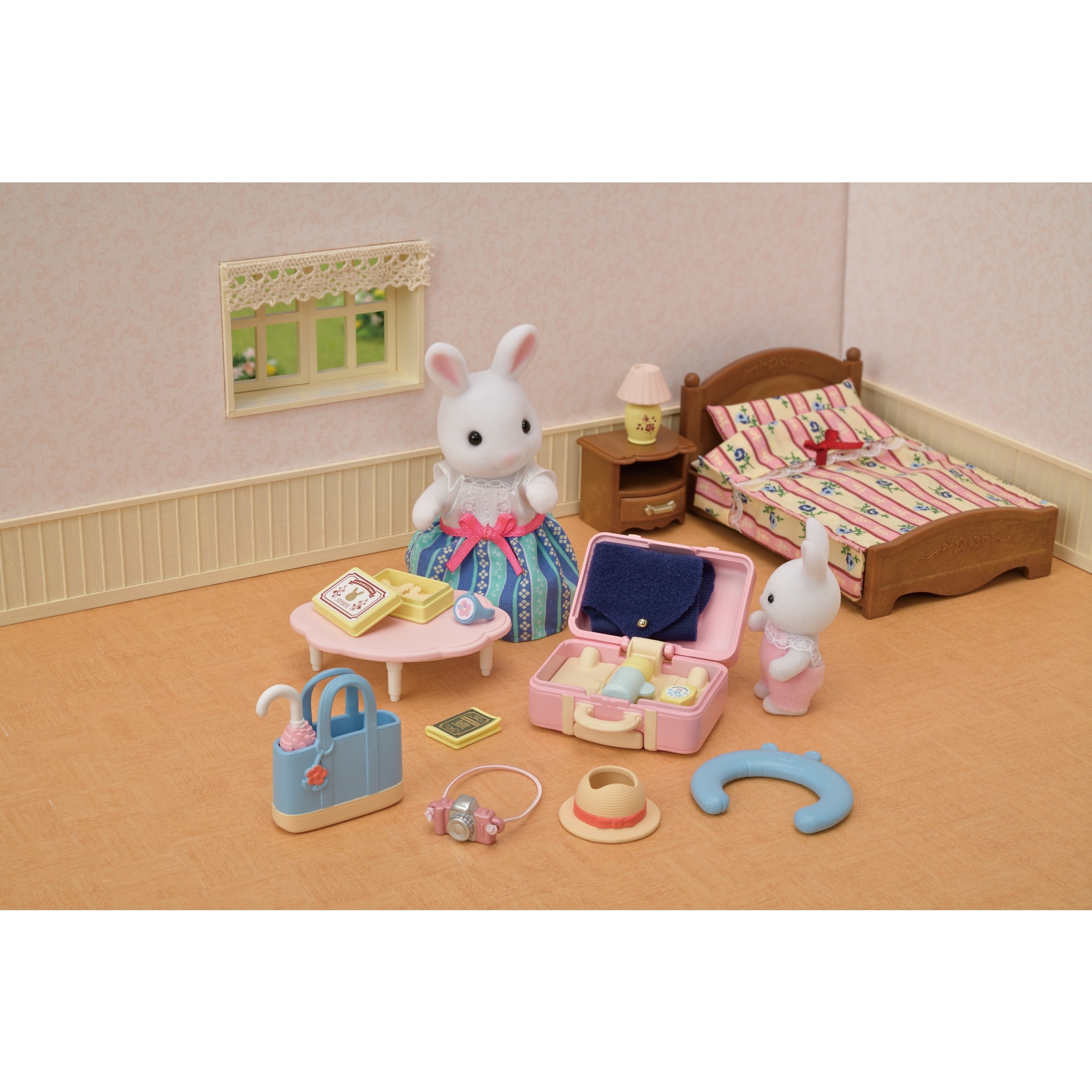 Voir la diapositive 7 : La maman lapin neige et sa valise de weekend