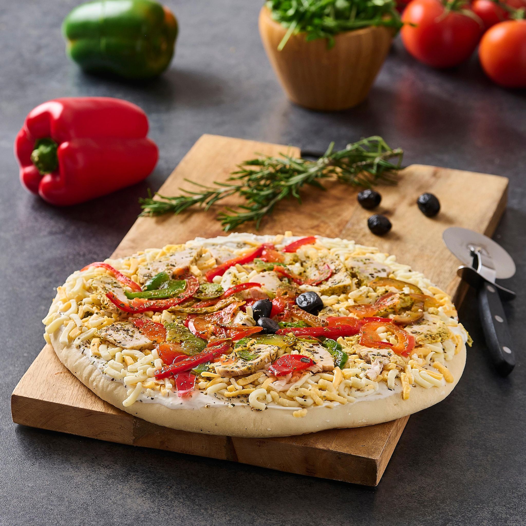 AUCHAN LE TRAITEUR Pizza crue poulet curry 540 g 
