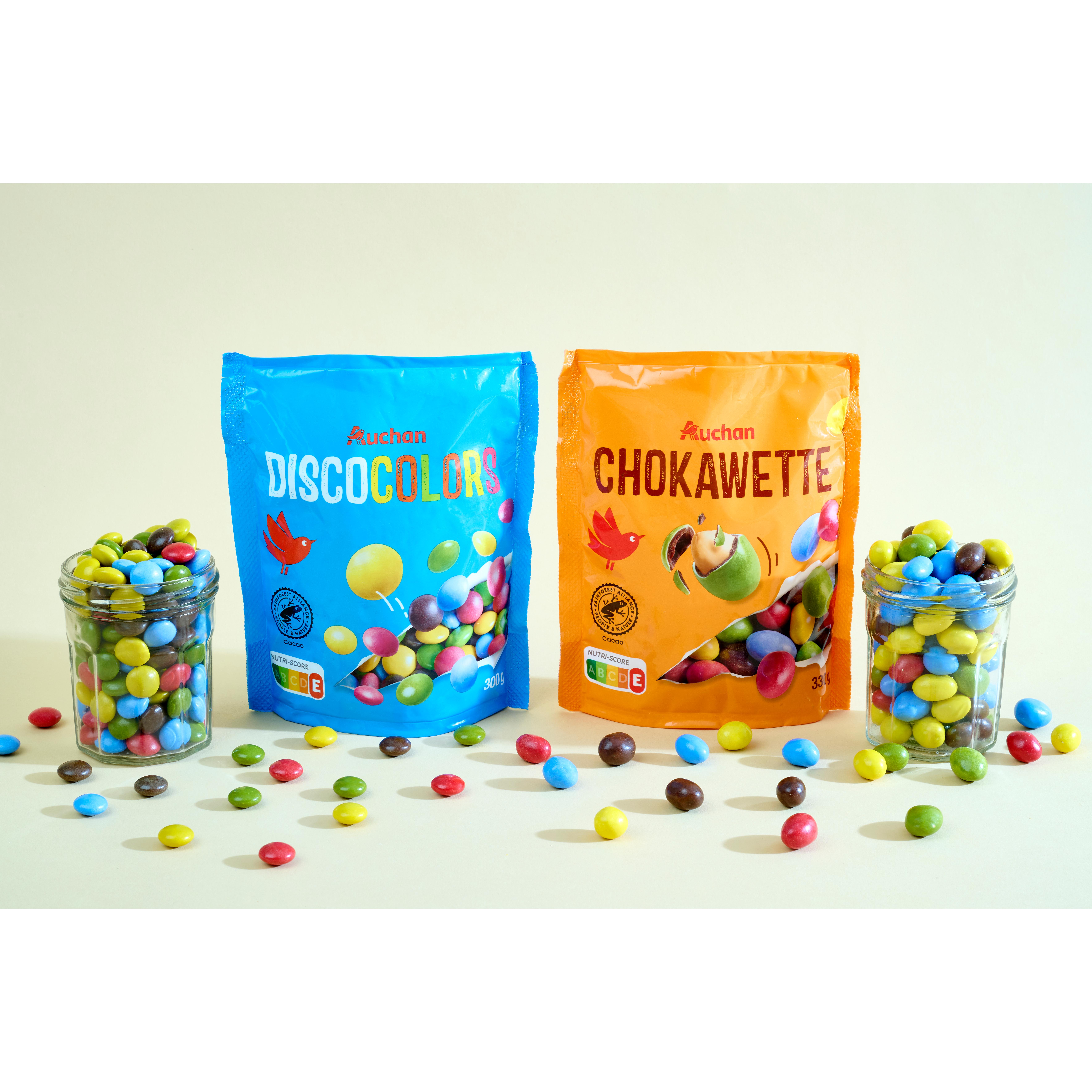 Voir la diapositive 2 : AUCHAN Billes de chocolat au lait dragéifiées 12 billes 300g
