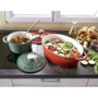 Voir la diapositive 2 : SITRAM Cocotte en fonte ovale induction 6.5 litres vert sauge intérieur blanc