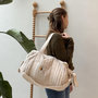 Voir la diapositive 4 : Petit Béguin Sac à langer en gaze de coton Eden