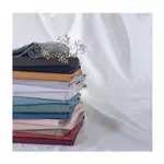 ACTUEL Drap plat uni en coton 57 fils - collection permanente. Coloris disponibles : Bleu, Gris, Blanc, Vert, Jaune, Beige, Rose, Rouge, Taupe