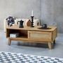 Voir la diapositive 2 : SWEEEK Table basse avec 2 niches. 1 porte coulissante. effet bois et cannage. pieds eucalyptus