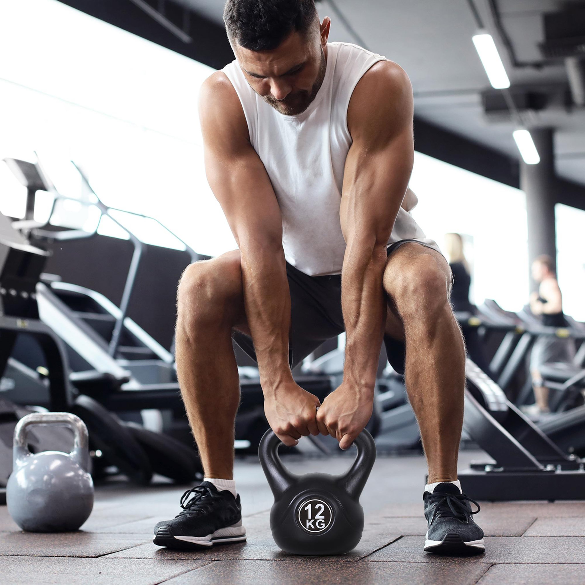 Voir la diapositive 2 : HOMCOM Kettlebell 12 kg - haltère boule - poignée ergonomique - pvc noir